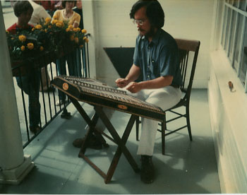 Playing on the porch of the Murray Hotel, Mackinac Island, Michigan (1977)