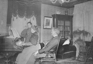 Henry Wilson giving piano lesson, Corry, Pa., c.1890.